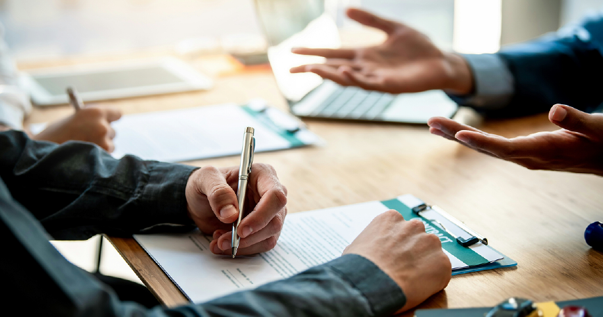People talking and discussing legal contracts in South Africa